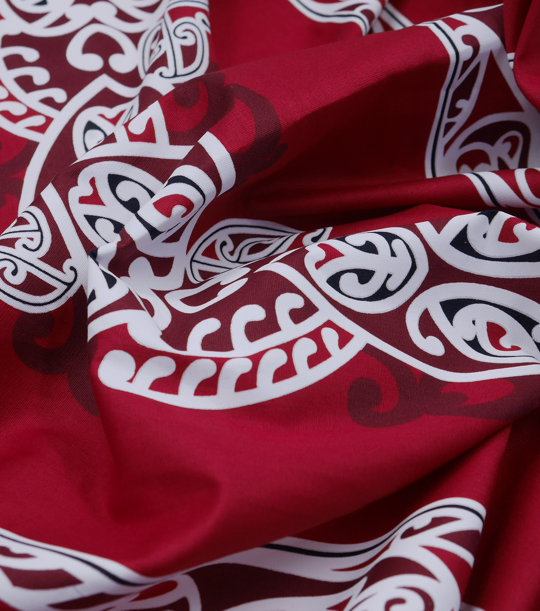 COTTON MAORI KORU DESIGN $8.00P/M - maroon